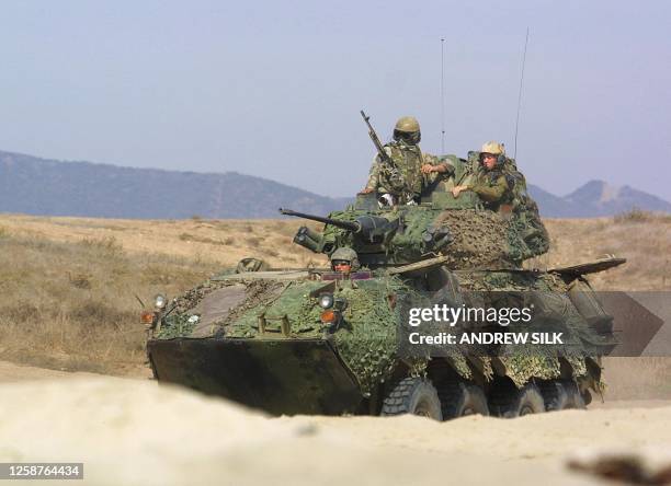 Marines of the 13th Marine Expeditionary Unit assault Red Beach with LAV-25 Light Armored Vehicles at Camp Pendleton near Oceanside, CA, 15 October...