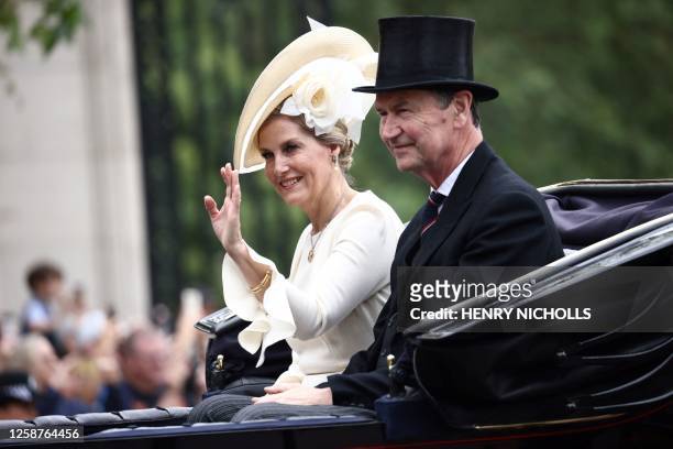 Britain's Sophie, Duchess of Edinburgh and Vice Admiral Timothy Laurence leave on horse carriage Buckingham Palace during the King's Birthday Parade,...