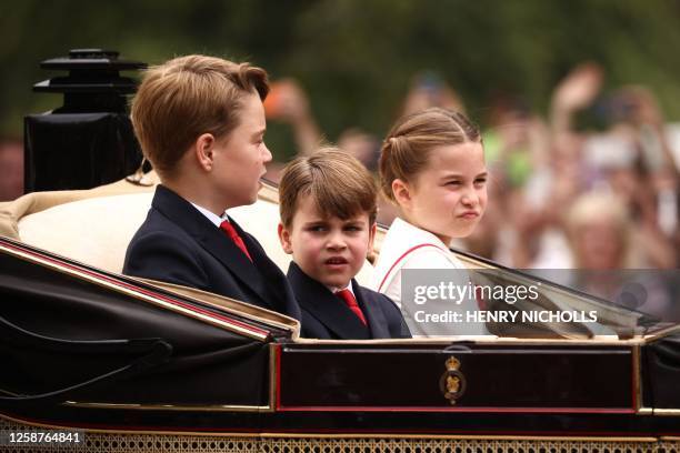 Britain's Prince George of Wales, Britain's Prince Louis of Wales and Britain's Princess Charlotte of Wales leave Buckingham Palace on horse carriage...