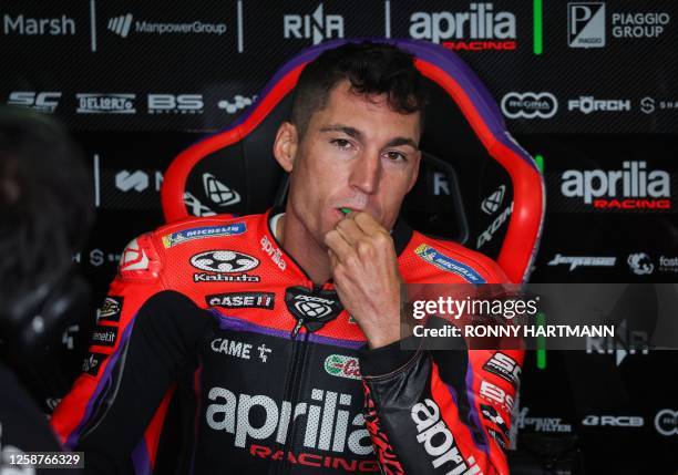 Aprilia Racing Team's Spanish rider Aleix Espargaro sits in his box during the free practice for the MotoGP German motorcycle Grand Prix at the...