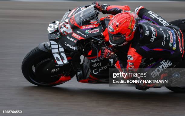 Aprilia Racing Team's Spanish rider Maverick Vinales steers his motorbike during the qualifying session for the MotoGP German motorcycle Grand Prix...