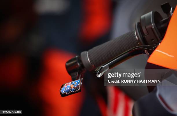 Throttle lever and rear view mirror are seen on the motorbike from Red Bull KTM Factory Racing Team's Australian rider Jack Miller during the free...