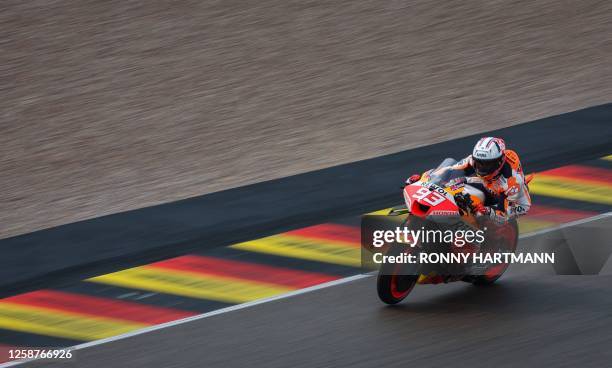 Honda Spanish rider Marc Marquez steers his motorbike during the qualifying session for the MotoGP German motorcycle Grand Prix at the Sachsenring...