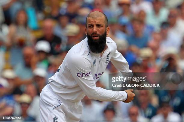 England's Moeen Ali bowls during play on day two of the first Ashes cricket Test match between England and Australia at Edgbaston in Birmingham,...