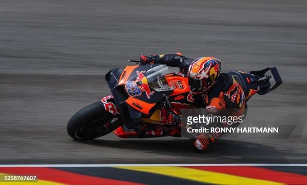 Red Bull KTM Factory Racing Team's Australian rider Jack Miller steers his motorbike during the qualifying session for the MotoGP German motorcycle...