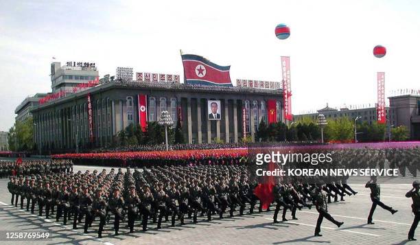 Troops parade in Pyongyang 25 April 2002 to celebrate the 70th anniversary of the founding of Korean People's Army. Thousands of troops swore...