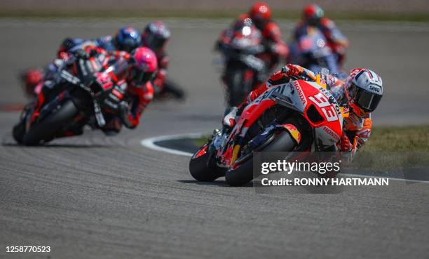 Repsol Honda Team's Spanish rider Marc Marquez competes during the Sprint race of the MotoGP German motorcycle Grand Prix at the Sachsenring racing...
