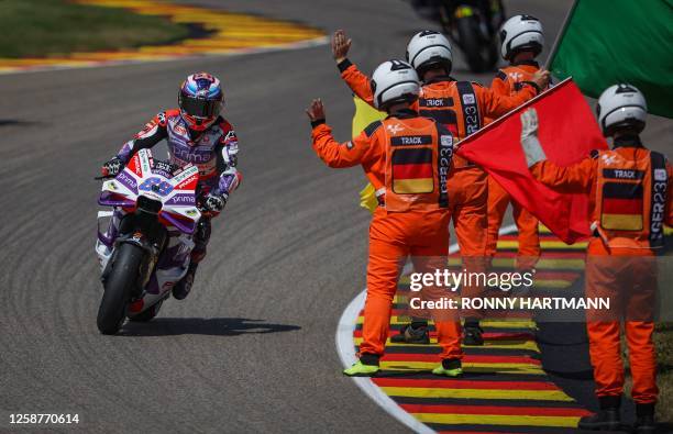 Ducati Pramac Racing Team's Spanish rider Jorge Martin celebrates after winning the Sprint race ahead of the MotoGP German motorcycle Grand Prix at...