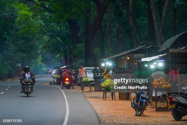 Man rides a motorcycle on the forest road in Kurunegala, Sri Lanka, on June 17, 2023. Kurunegala is a major city in Sri Lanka. It is the capital city...