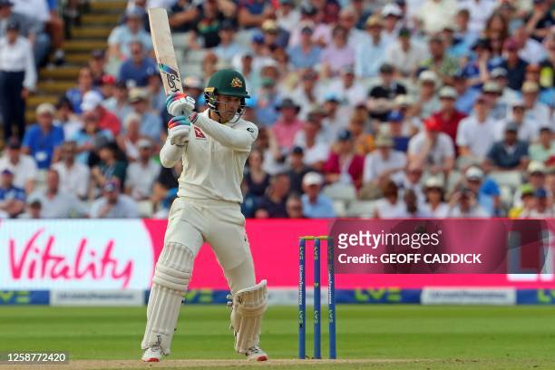 Australia's wicket keeper Alex Carey hits a boundary during play on day two of the first Ashes cricket Test match between England and Australia at...