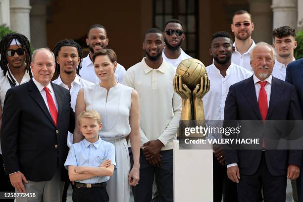 Prince Albert II of Monaco , Prince Jacques of Monaco and Princess Charlene of Monaco pose with the AS Monaco Basket team players and leading staff,...
