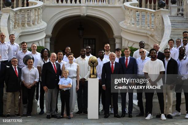 Prince Albert II of Monaco , Prince Jacques of Monaco and Princess Charlene of Monaco pose with the AS Monaco Basket team players and staff next to...