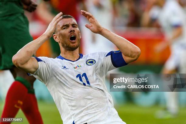 Bosnia-Herzegovina's forward Edin Dzeko reacts during the UEFA Euro 2024 group J qualification football match between Portugal and Bosnia-Herzegovina...