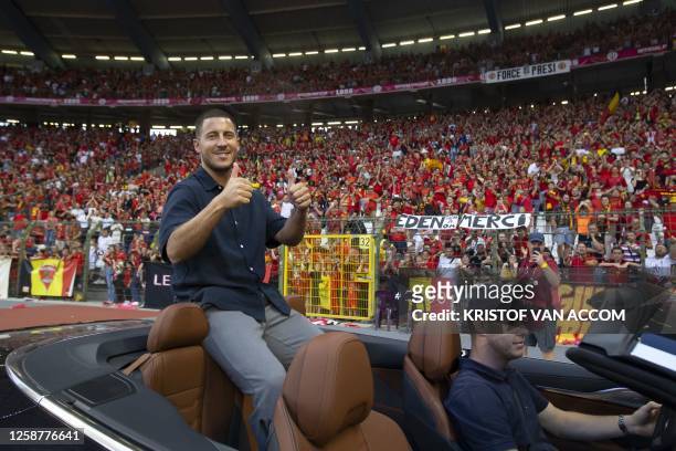Former Belgium's forward Eden Hazard gives thumbs up as he attends the UEFA Euro 2024 group F qualification football match between Belgium and...