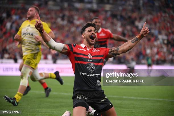 Toulouse's French fly-half Romain Ntamack celebrates after scoring a try during the French Top14 rugby union final match between Stade Toulousain...