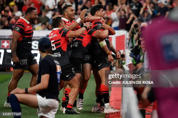 Toulouse's French fly-half Romain Ntamack celebrates after scoring a try during the French Top14 rugby union final match between Stade Toulousain...