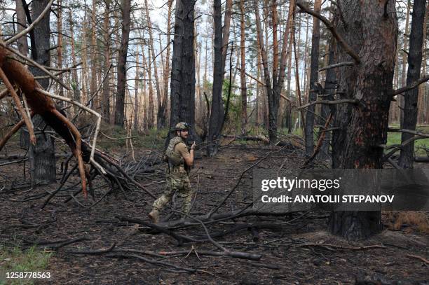 Ukrainian soldier holds his positions at the front line near the town of Kreminna, Lugansk region, on June 17 amid the Russian invasion of Ukraine.