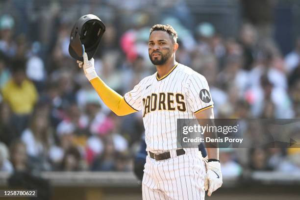 Xander Bogaerts of the San Diego Padres tosses his helmet after striking out during the third inning of a baseball game against the Tampa Bay Rays...