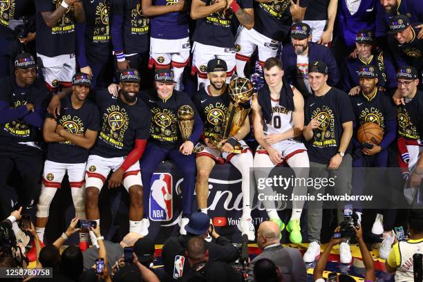 The Denver Nuggets pose for a photo after winning game 5 of the 2023 NBA Finals against the Miami Heat on June 12, 2023 at the Ball Arena in Denver,...