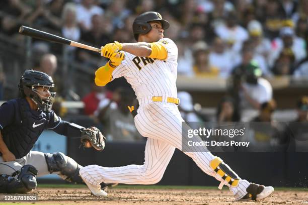 Juan Soto of the San Diego Padres hits a sacrifice during the fifth inning of a baseball game against the Tampa Bay Rays on June 17, 2023 at Petco...