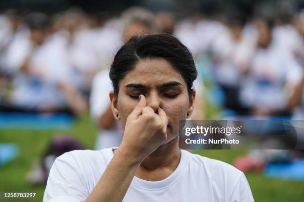 Yoga enthusiasts perform during a mass yoga exercise to celebrate the International Day of Yoga in Bangkok, Thailand, 18 June 2023. Hundreds of Thai...