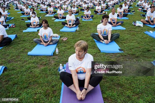 Yoga enthusiasts perform during a mass yoga exercise to celebrate the International Day of Yoga in Bangkok, Thailand, 18 June 2023. Hundreds of Thai...