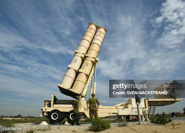 Israeli soldiers raise an Arrow missile launcher to it's up right position during a tour for foreign correspondents at the Palmahim air force base...