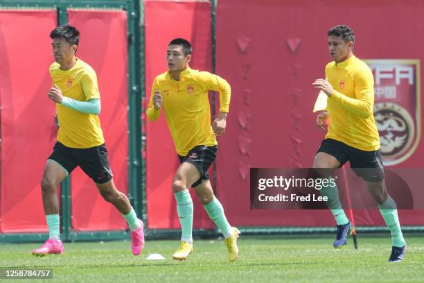 Wu Lei and Ai Kesen of China in action during a training session ahead of an international friendly match against Palestine at Dalian Barracuda Bay...