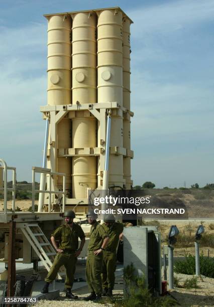 Israeli soldiers stand in front of an Arrow missile launcher with it's six missiles, during a tour for foreign correspondents at the Palmahim air...