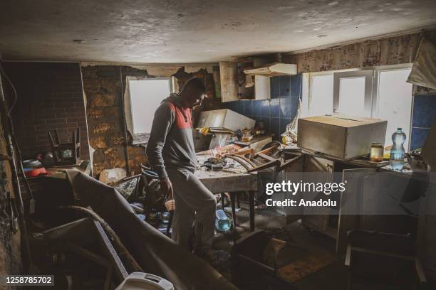 Genadiy Nejlukcenko, a resident of the village of Vasylivka is seen at damaged house by the floods in Mykolaiv, Ukraine on June 15, 2023. More than...