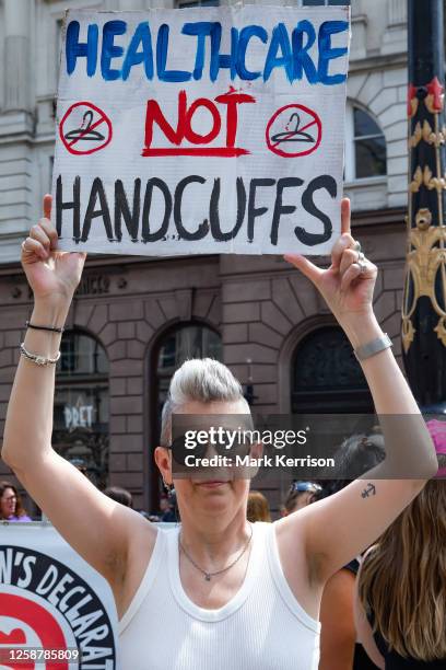 An abortion rights campaigner protests outside the Royal Courts of Justice before a march to Westminster to demand reform of the abortion law on 17...