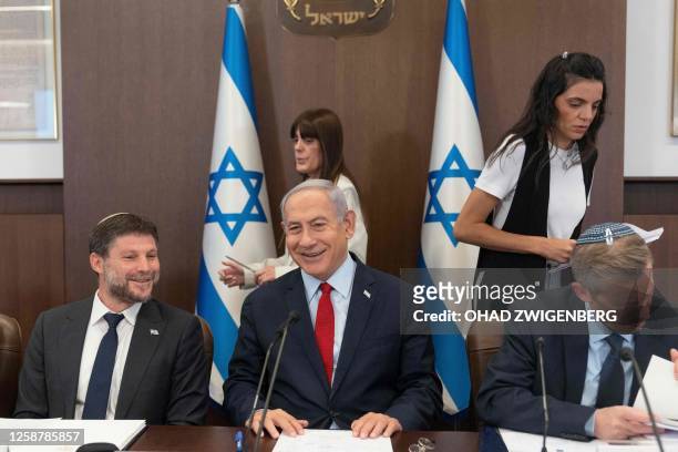 Israeli Prime Minister Benjamin Netanyahu and Minister of Finance Bezalel Smotrich attend a weekly cabinet meeting in the prime minister's office in...