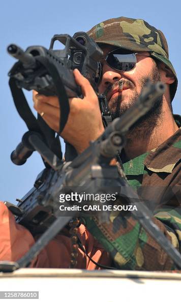A rebel fighter looks through the site of his rifle in Ragdalin ...