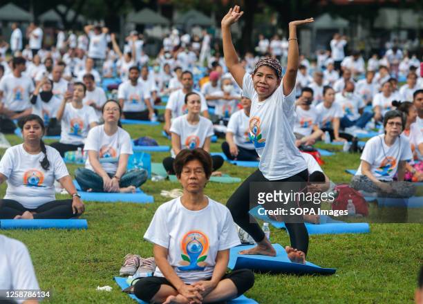 Participants practice yoga to mark the 9th International Day of Yoga, in Bangkok.