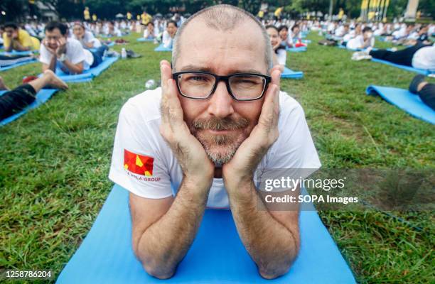 Participants practice yoga to mark the 9th International Day of Yoga, in Bangkok.