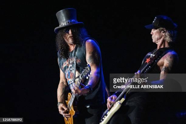 Members of the US hard rock band Guns N' Roses perform on Helviti Stage at the Copenhell heavy metal music festival in Copenhagen, Denmark, on June...
