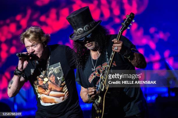 Axl Rose , singer of the US hard rock band Guns N' Roses, and lead guitarist Saul Hudson aka Slash perform on Helviti Stage at the Copenhell heavy...