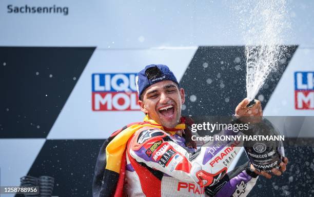 Ducati Pramac Racing Team's Spanish rider Jorge Martin celebrates on the podium after winning the MotoGP German motorcycle Grand Prix at the...