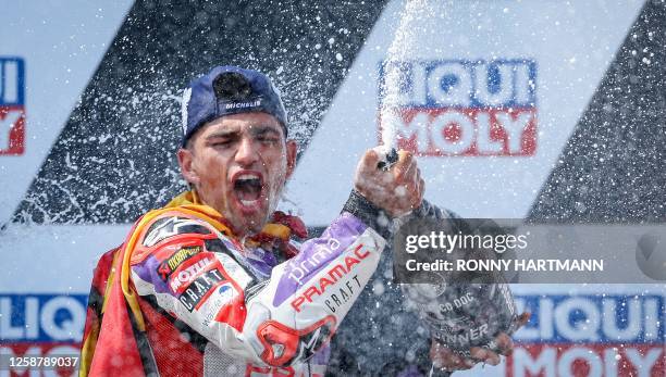 Ducati Pramac Racing Team's Spanish rider Jorge Martin celebrates on the podium after winning the MotoGP German motorcycle Grand Prix at the...