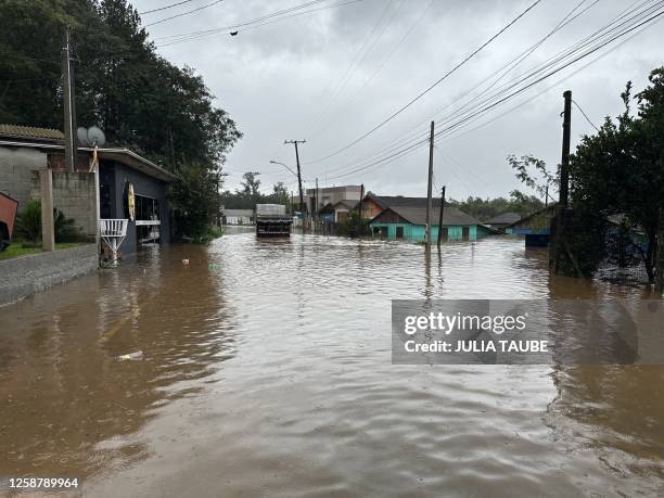Truck drives through a flooded street in the city of Lindolfo Collor, Rio Grande do Sul State, after an extratropical cyclone hit the southern region...