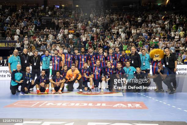 The players of FC Barcelona line up for a team photo with the bronze medal after the EHF FINAL4 Men Champions League bronze medal match between Barca...