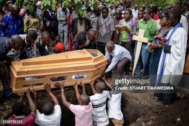 Mourners gather for funeral of Florence Masika and Zakayo Masereka during their burial rituals in Mpondwe on June 18, 2023. Florence and Zakayo have...