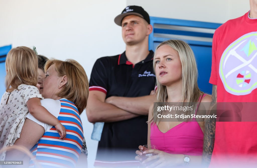 Nikola Jokic of Denver Nuggets and his wife Natalija Jokic watch a