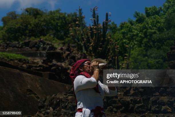 Mayan council leader blows a shell during a Summer Solstice celebration ceremony organized by the Mayan council at the Tazumal Archaeological Site on...
