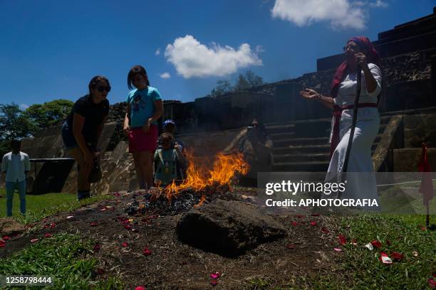 People offer to fire altar during a Summer Solstice celebration ceremony organized by the Mayan council at the Tazumal Archaeological Site on June...
