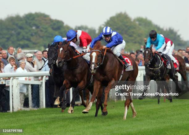 Jockey Richard Hills riding Etlaala winning the Champagne Stakes at Doncaster 10th September 2004. Placed second Irish Jockey Kieren Fallon riding...