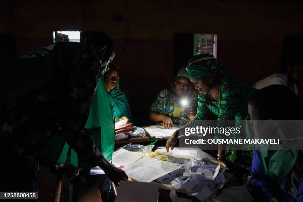 Election officials start to count the ballots in Mali's referendum in Bamako on June 18, 2023. Malians head to the polls to vote in a referendum to...