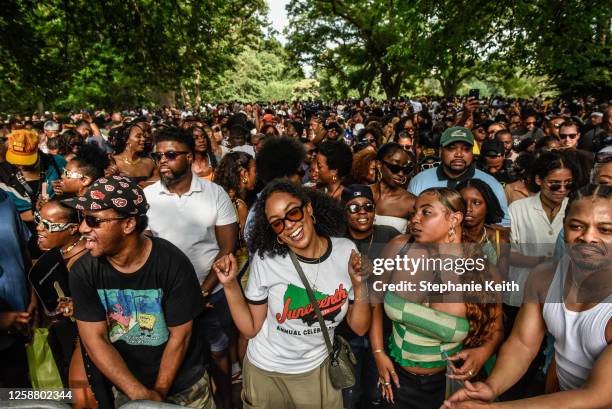 People participate in a Juneteenth celebration in Fort Greene park on June 18, 2023 in the Brooklyn borough of New York City. Originating in...