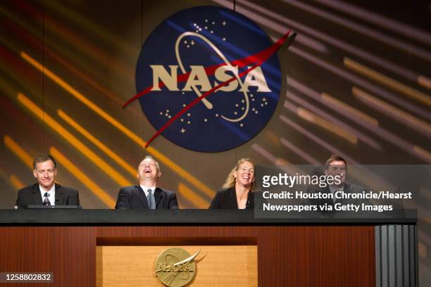 Commander Chris Ferguson, pilot Doug Hurley, mission specialist Sandy Magnus and mission specialist Rex Walheim laugh in response to a statement by...