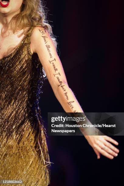 The lyrics "It's love's illusions I recall. I really don't know love at all" from Joni Mitchell's song "Both Sides Now" are written on her arm as...